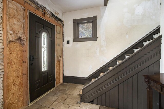 1122 Main St, Saint Joseph, MI 49085 - entrance foyer featuring stone tile flooring, plenty of natural light, and stairs