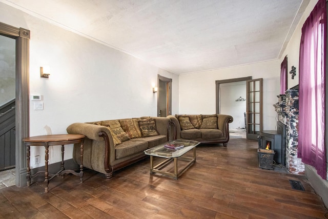 1122 Main St, Saint Joseph, MI 49085 - living room with hardwood / wood-style flooring, a wood stove, and crown molding