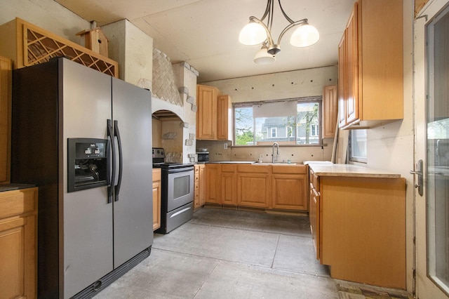 1122 Main St, Saint Joseph, MI 49085 - kitchen with appliances with stainless steel finishes, a sink, custom range hood, and pendant lighting