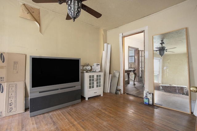 1122 Main St, Saint Joseph, MI 49085 - living area featuring a ceiling fan, wood finished floors, and vaulted ceiling