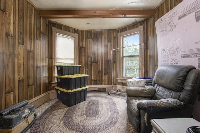 1122 Main St, Saint Joseph, MI 49085 - sitting room featuring wooden walls, carpet floors, and beamed ceiling