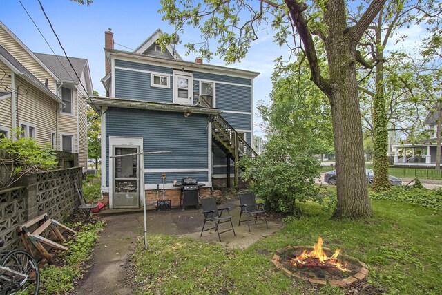 1122 Main St, Saint Joseph, MI 49085 - back of property with a fire pit and a patio