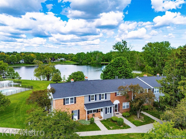 20094 Bryn Mawr Ct Unit 166, Northville, MI 48167 - view of front facade with a water view, brick siding, and a front yard