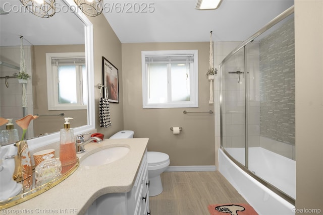 34143 Zimmer Dr, Sterling Heights, MI 48310 - full bath featuring vanity, toilet, combined bath / shower with glass door, and baseboards