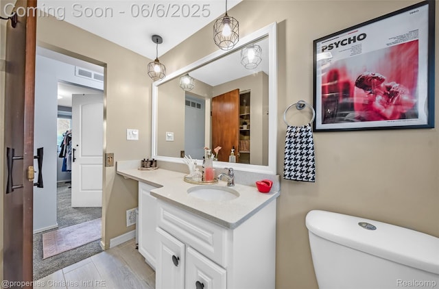 34143 Zimmer Dr, Sterling Heights, MI 48310 - half bathroom with vanity and toilet