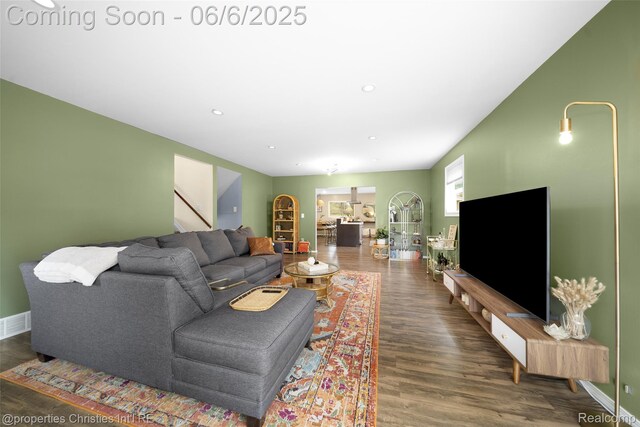 34143 Zimmer Dr, Sterling Heights, MI 48310 - living area with wood finished floors, stairs, baseboards, and recessed lighting