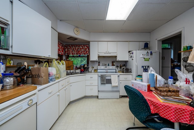 8324 Hagar Shore Rd, Watervliet, MI 49098 - kitchen featuring white appliances, a drop ceiling, a sink, light countertops, and white cabinetry