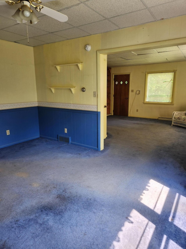 8324 Hagar Shore Rd, Watervliet, MI 49098 - spare room featuring ceiling fan, carpet floors, and a paneled ceiling