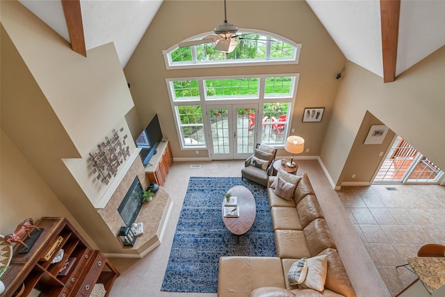 4132 Winding Way, Kalamazoo, MI 49004 - living area featuring high vaulted ceiling, ceiling fan, baseboards, plenty of natural light, and a fireplace