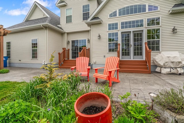 4132 Winding Way, Kalamazoo, MI 49004 - rear view of property featuring entry steps, a patio, and a shingled roof