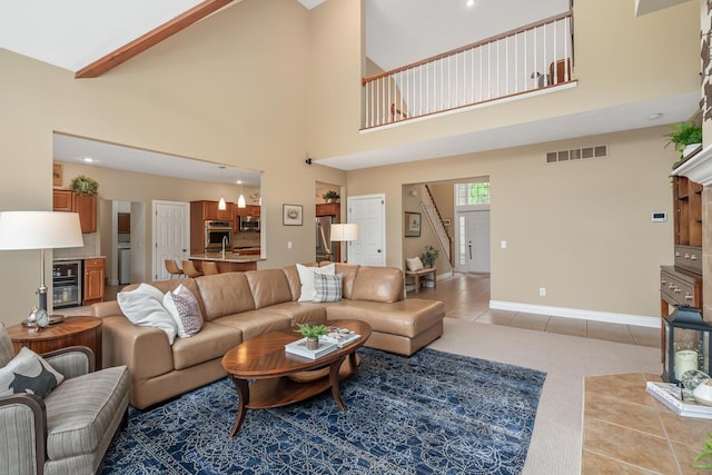 4132 Winding Way, Kalamazoo, MI 49004 - living area with light tile patterned flooring, a towering ceiling, and baseboards