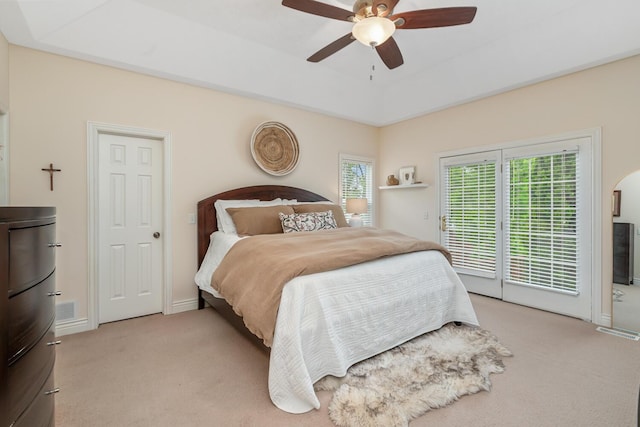 4132 Winding Way, Kalamazoo, MI 49004 - bedroom featuring light colored carpet, access to outside, a ceiling fan, and a tray ceiling