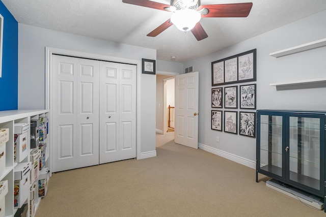 4132 Winding Way, Kalamazoo, MI 49004 - unfurnished bedroom featuring carpet flooring, a closet, baseboards, and a ceiling fan