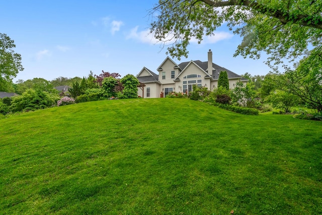 4132 Winding Way, Kalamazoo, MI 49004 - view of front of property with a front yard and a chimney