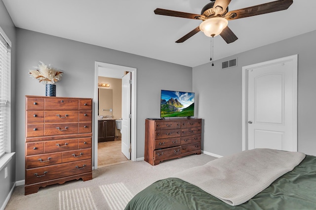 449 Corinth Cir, Dundee, MI 48131 - bedroom featuring light colored carpet, baseboards, connected bathroom, and ceiling fan