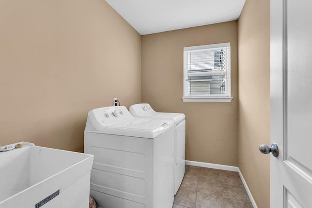 449 Corinth Cir, Dundee, MI 48131 - laundry area with washer and clothes dryer, baseboards, and light tile patterned floors