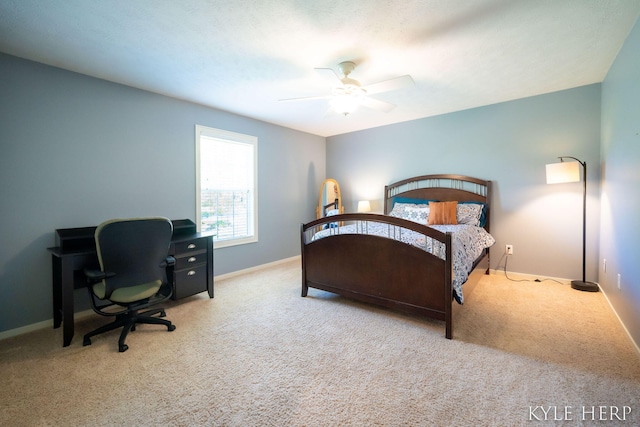 8718 Little Bend Ct, Middleville, MI 49333 - carpeted bedroom with baseboards, a desk, and a ceiling fan