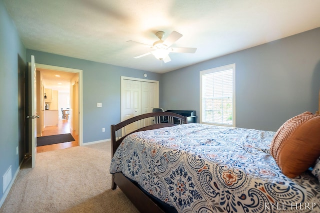 8718 Little Bend Ct, Middleville, MI 49333 - carpeted bedroom with a closet, baseboards, and a ceiling fan