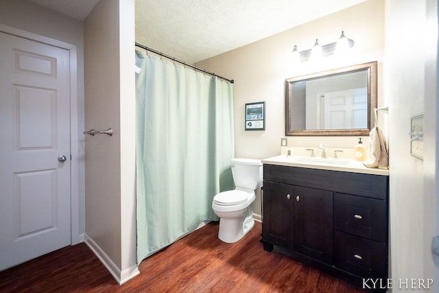 8718 Little Bend Ct, Middleville, MI 49333 - full bathroom with wood finished floors, toilet, vanity, and baseboards
