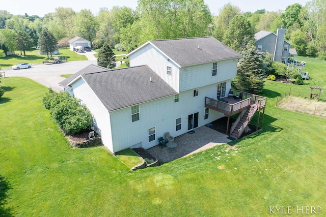 8718 Little Bend Ct, Middleville, MI 49333 - back of house featuring roof with shingles, a deck, stairway, and a yard