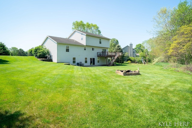 8718 Little Bend Ct, Middleville, MI 49333 - rear view of property with an outdoor fire pit, a deck, a yard, and stairs