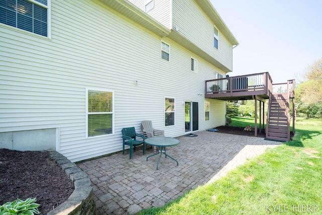 8718 Little Bend Ct, Middleville, MI 49333 - rear view of property featuring stairs, a deck, a patio, and a lawn