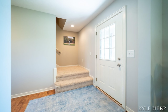 8718 Little Bend Ct, Middleville, MI 49333 - entryway with wood finished floors, stairway, baseboards, and recessed lighting