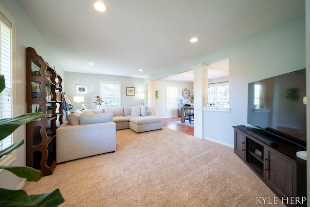 8718 Little Bend Ct, Middleville, MI 49333 - living room featuring carpet flooring, recessed lighting, decorative columns, and baseboards