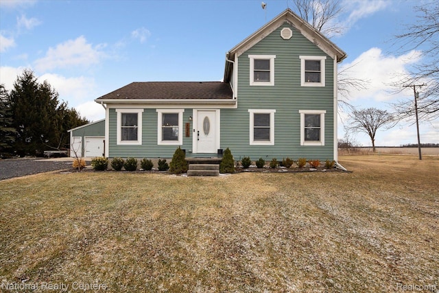 2020 Nicholson Rd, Fowlerville, MI 48836 - traditional-style home with a front lawn and a detached garage