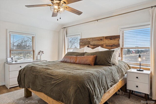 2020 Nicholson Rd, Fowlerville, MI 48836 - bedroom with vaulted ceiling, wood finished floors, and a ceiling fan