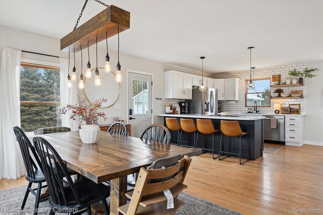 2020 Nicholson Rd, Fowlerville, MI 48836 - dining area with plenty of natural light and light wood-style floors