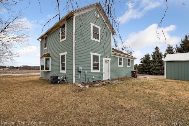 2020 Nicholson Rd, Fowlerville, MI 48836 - rear view of house with a yard and cooling unit