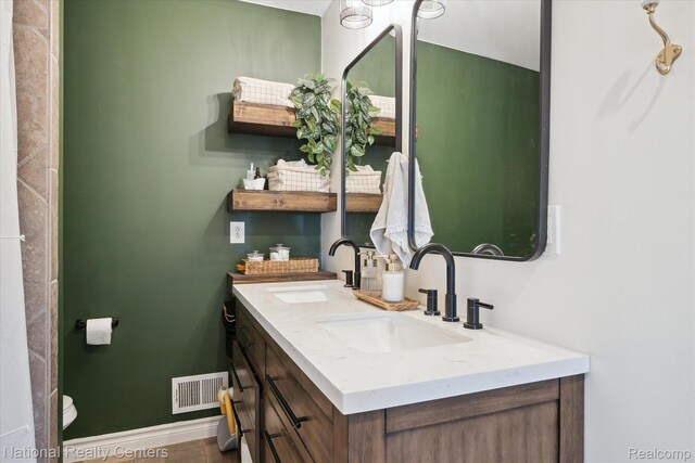 2020 Nicholson Rd, Fowlerville, MI 48836 - full bath with double vanity and baseboards