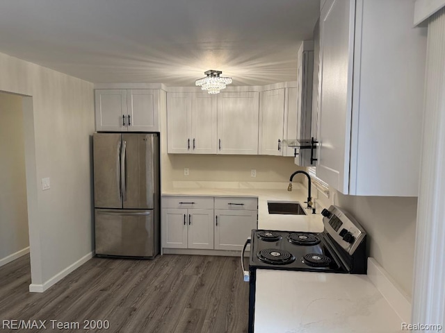 29054 Burning Tree Ln, Romulus, MI 48174 - kitchen with freestanding refrigerator, a sink, electric stove, and wood finished floors