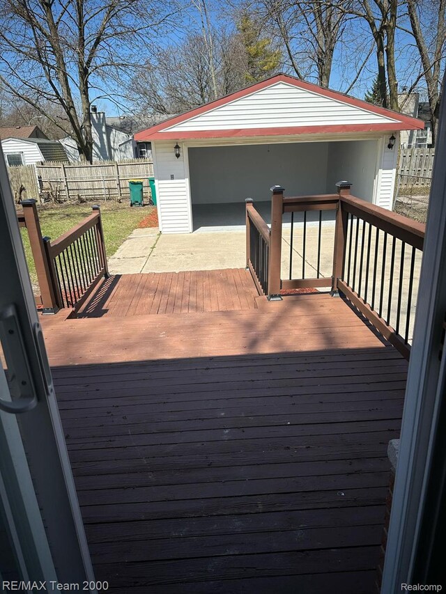 29054 Burning Tree Ln, Romulus, MI 48174 - wooden deck with a fenced backyard and a garage