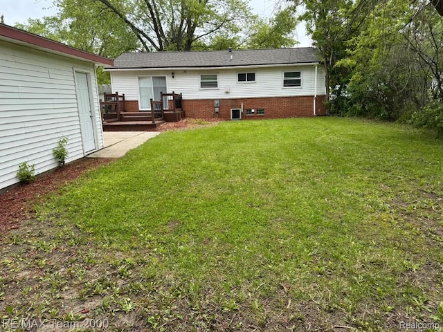 29054 Burning Tree Ln, Romulus, MI 48174 - rear view of house featuring a deck and a yard