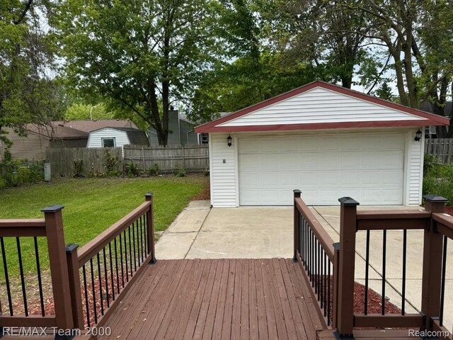 29054 Burning Tree Ln, Romulus, MI 48174 - wooden deck featuring an outbuilding and a garage
