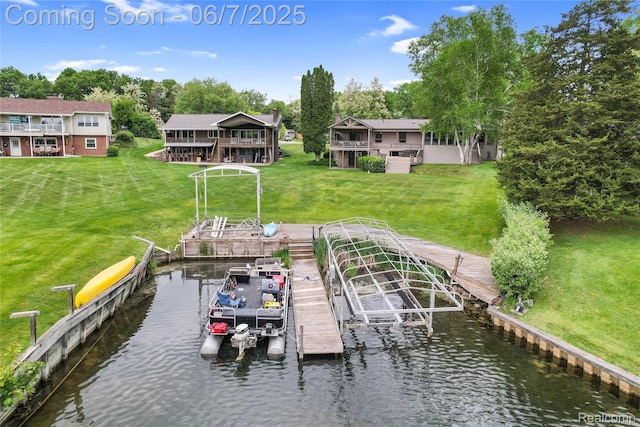 11404 Cedar Bend Dr, Pinckney, MI 48169 - dock featuring boat lift, a yard, view of scattered trees, and a deck with water view