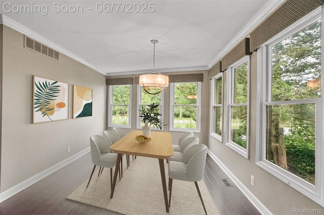 11404 Cedar Bend Dr, Pinckney, MI 48169 - dining space with crown molding, baseboards, and dark wood-style flooring