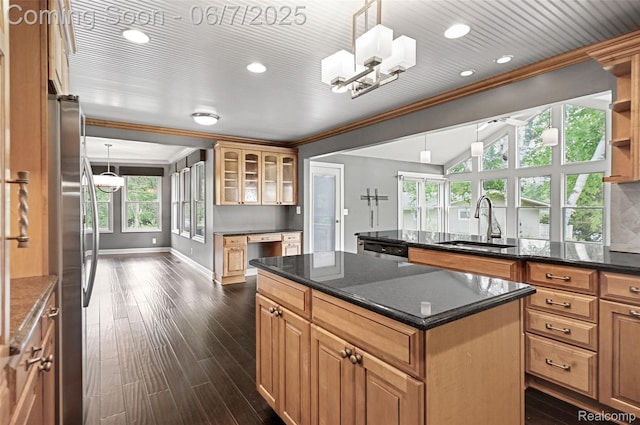 11404 Cedar Bend Dr, Pinckney, MI 48169 - kitchen with ornamental molding, a sink, freestanding refrigerator, healthy amount of natural light, and a center island