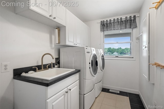 11404 Cedar Bend Dr, Pinckney, MI 48169 - washroom featuring washing machine and dryer, cabinet space, baseboards, and light tile patterned floors