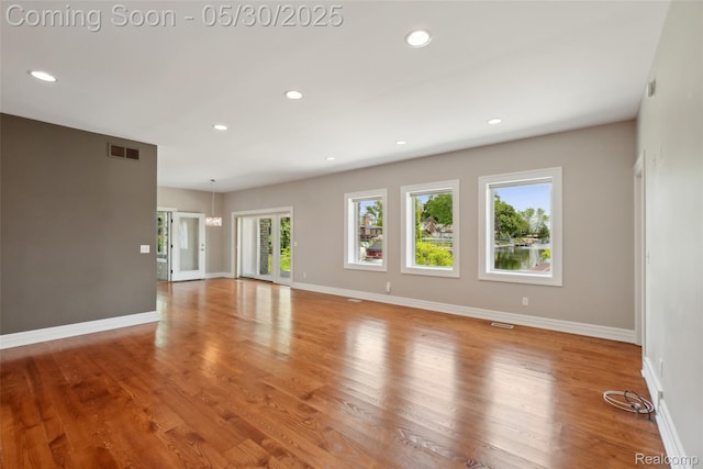 13525 Torrey Rd, Fenton, MI 48430 - unfurnished living room with recessed lighting, light wood finished floors, and baseboards