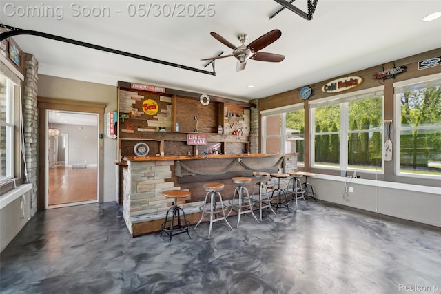 13525 Torrey Rd, Fenton, MI 48430 - indoor dry bar with finished concrete floors, plenty of natural light, and ceiling fan