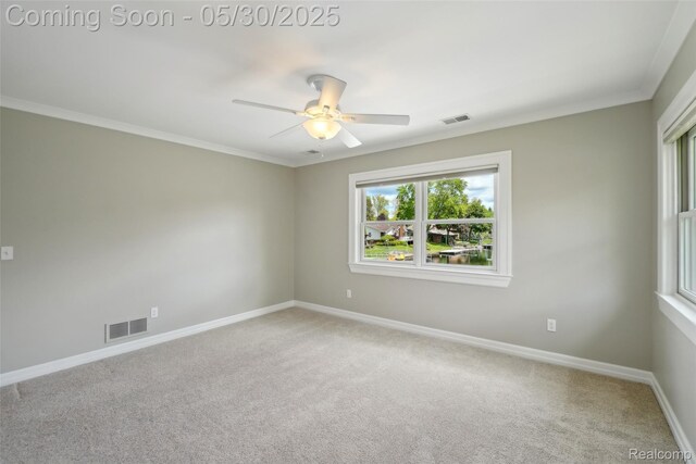 13525 Torrey Rd, Fenton, MI 48430 - carpeted spare room featuring baseboards, a ceiling fan, and crown molding
