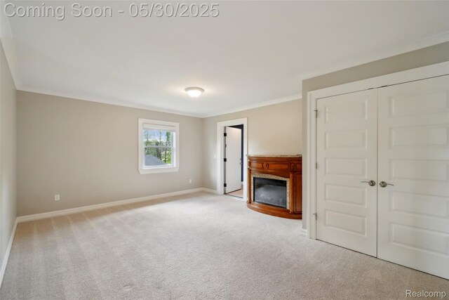 13525 Torrey Rd, Fenton, MI 48430 - unfurnished living room with a glass covered fireplace, carpet floors, baseboards, and ornamental molding