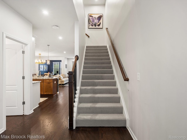 764 Hummingbird Dr, Rochester, MI 48307 - stairway with wood finished floors, recessed lighting, and baseboards