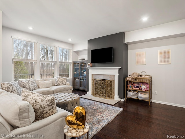 764 Hummingbird Dr, Rochester, MI 48307 - living room featuring wood-type flooring, a tiled fireplace, baseboards, and recessed lighting