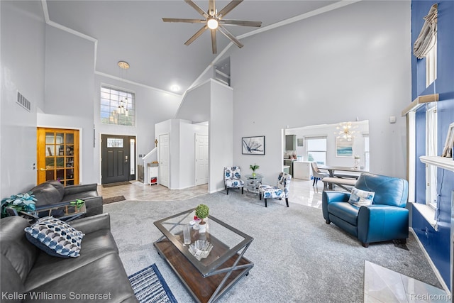 18615 Andrew Ln, New Boston, MI 48164 - living room featuring high vaulted ceiling, a chandelier, a ceiling fan, carpet floors, and ornamental molding