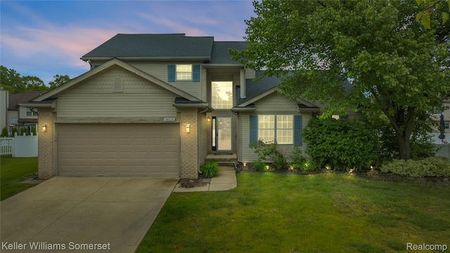 18615 Andrew Ln, New Boston, MI 48164 - view of front facade featuring driveway, an attached garage, and brick siding