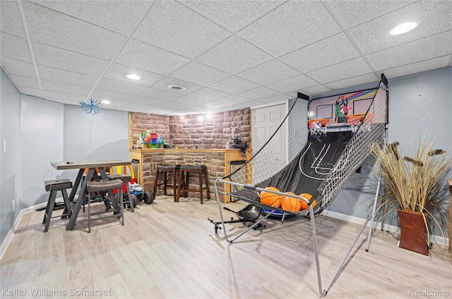 18615 Andrew Ln, New Boston, MI 48164 - recreation room featuring wood finished floors, baseboards, a paneled ceiling, recessed lighting, and a dry bar